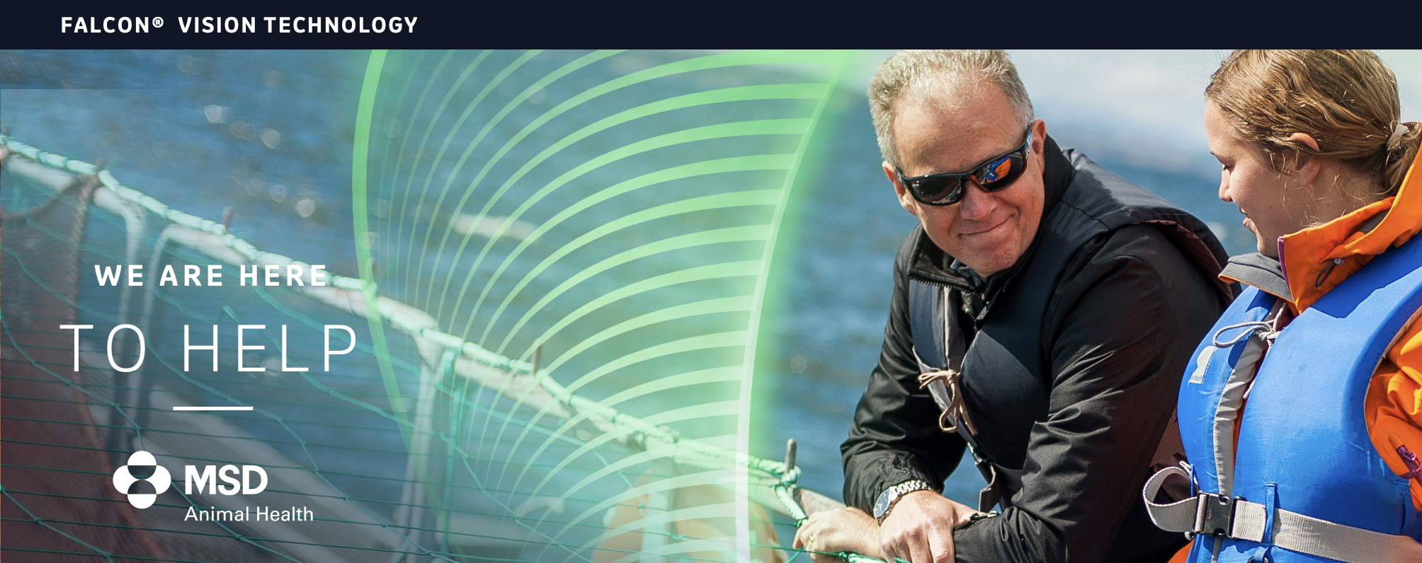 Picture of an older man and yonger woman using Falcon vision technology on a boat.